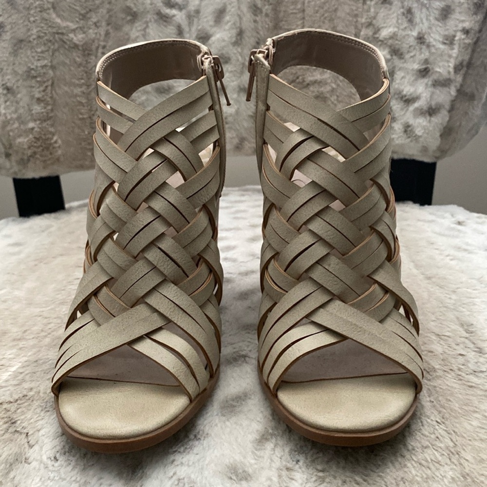 Creative leather design open toe and heel ankle boots.